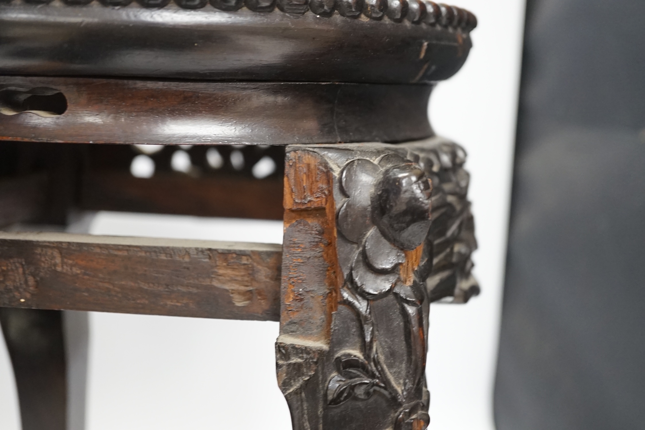 A Chinese hongmu stand, with inset marble top, 42cm high. Condition - poor to fair, section of frieze missing
